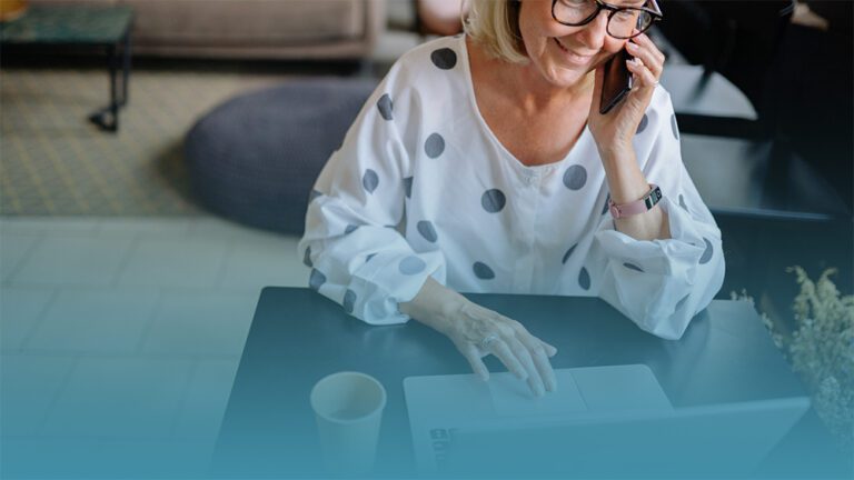 woman reads a guide for companies about supporting employees through natural disasters