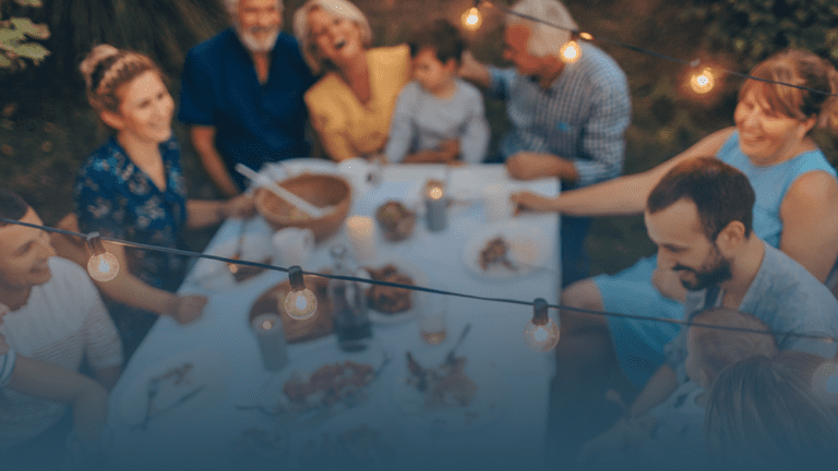 friends and family sitting around a table giving thanks for mental health support