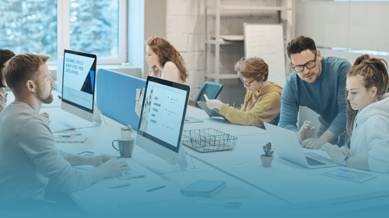 coworkers sit in an shared work space, engaged and productive, with their HR leaders creating a culture of well-being