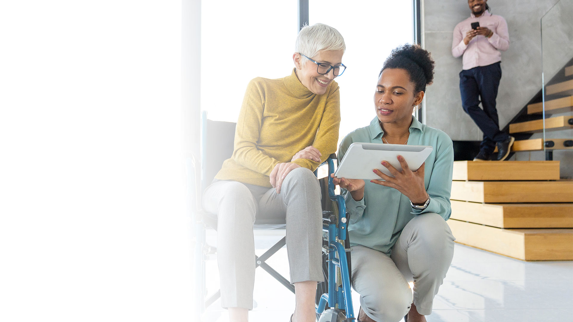 Two women accessing Uprise Health’s digital EAP for Health Plans and Carriers