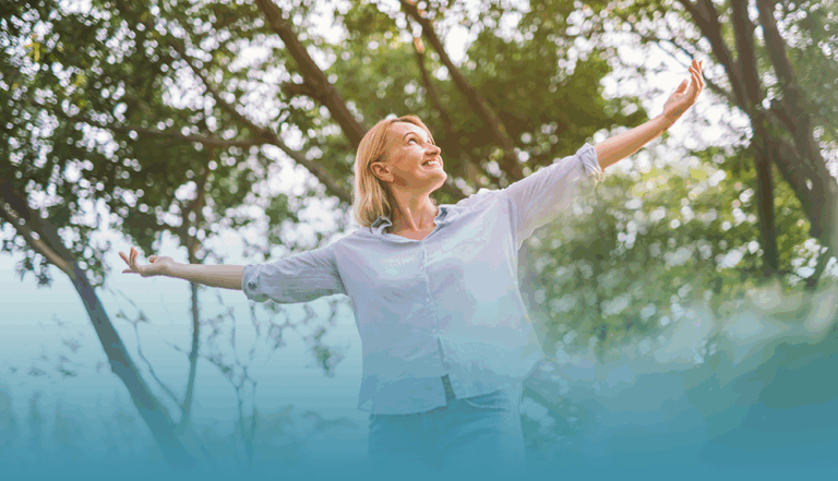 woman enjoys time in nature as she discovers how to create balance to improve mental health.