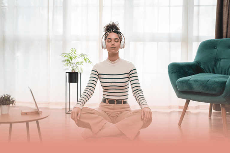 a woman practices mindfulness and meditation for a path to better mental health