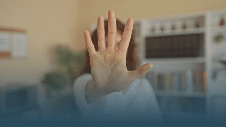 woman with hand outstretched demonstrating how to set healthy boundaries to protect mental health