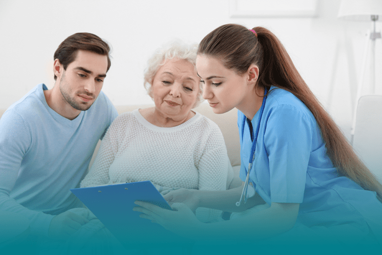 caregiver and their loved one meeting with a healthcare professional demonstrating navigating healthcare systems as a caregiver