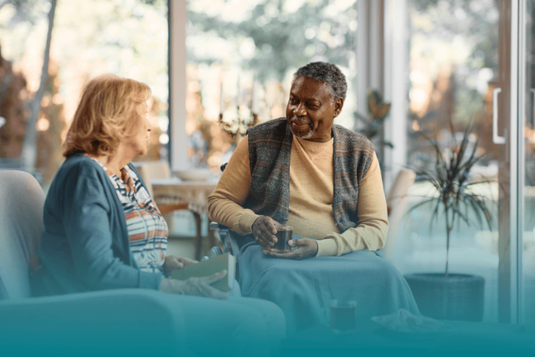 Caregiver takes a moment to rest with a loved one to prevent burnout.